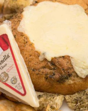 Stella's Fontinella cheese goes into melty perfection on this Cheese Fondue in a Bread Bowl recipe