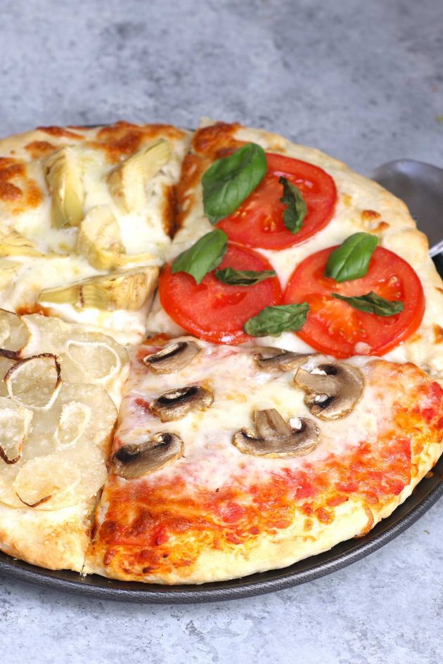 Four Seasons Pizza is divided into sections with different toppings representing the four seasons. This classic Italian recipe starts with homemade pizza dough and fresh ingredients for the best flavor. It’s so much fun to make and eat!