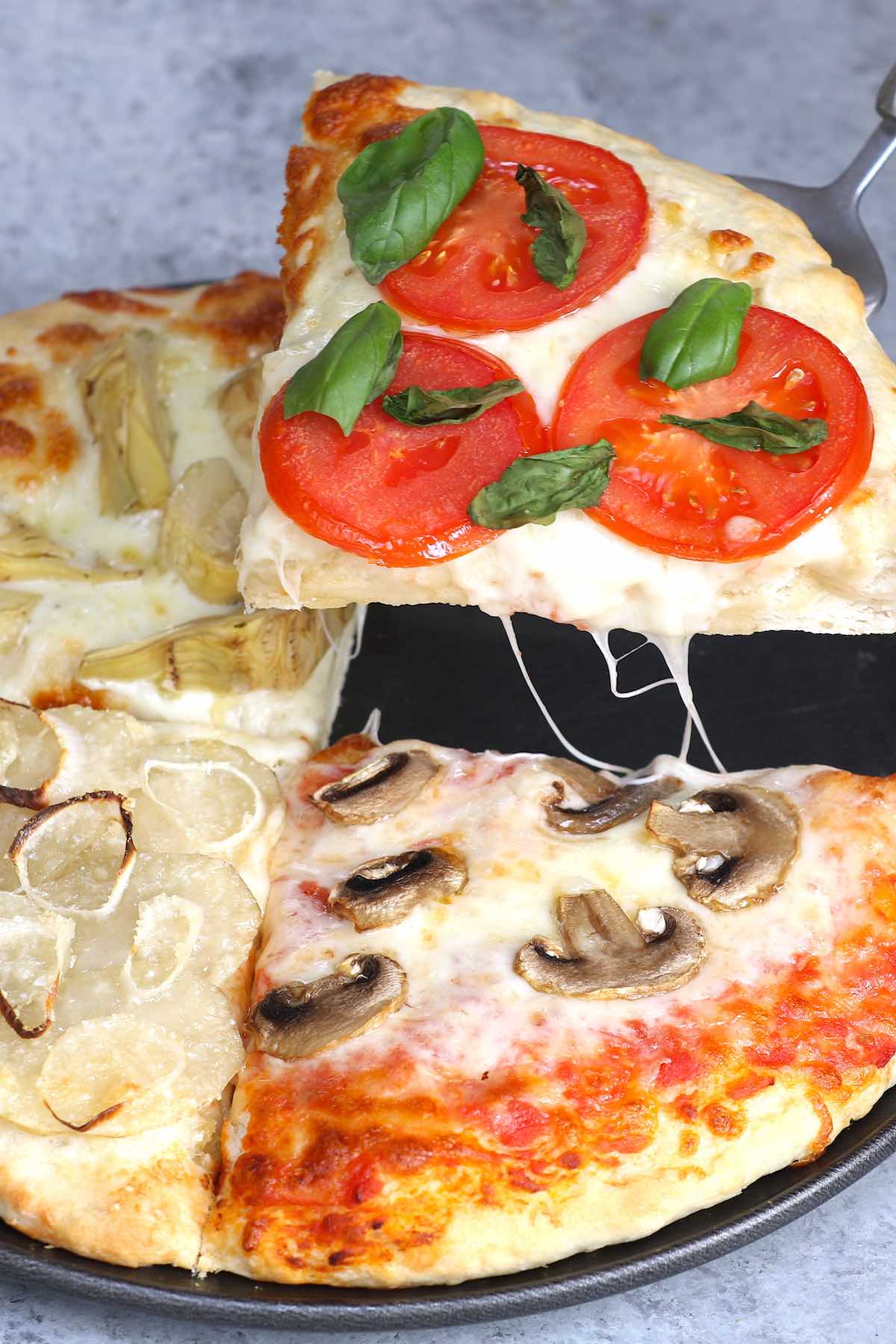 Four Seasons Pizza is divided into sections with different toppings representing the four seasons. This classic Italian recipe starts with homemade pizza dough and fresh ingredients for the best flavor. It’s so much fun to make and eat!