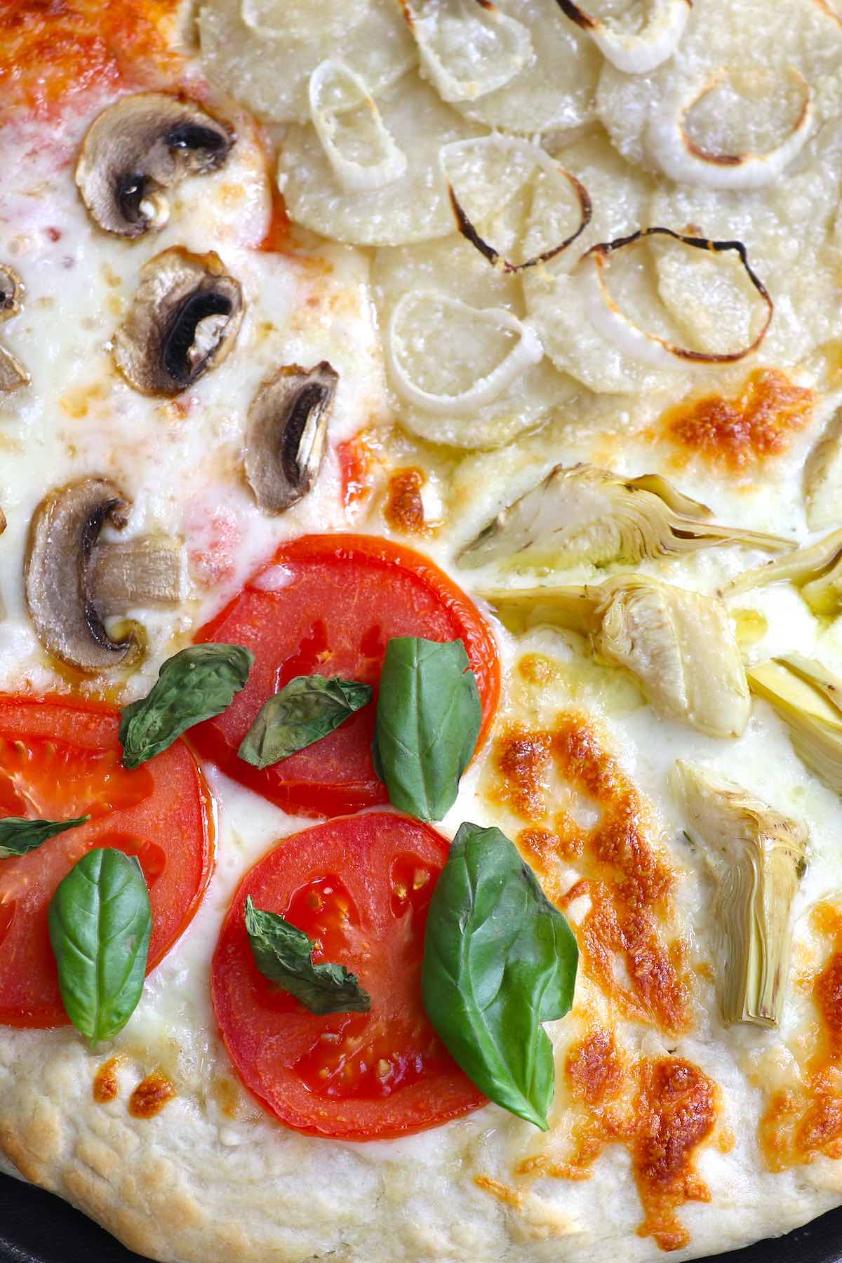 Four Seasons Pizza is divided into sections with different toppings representing the four seasons. This classic Italian recipe starts with homemade pizza dough and fresh ingredients for the best flavor. It’s so much fun to make and eat!