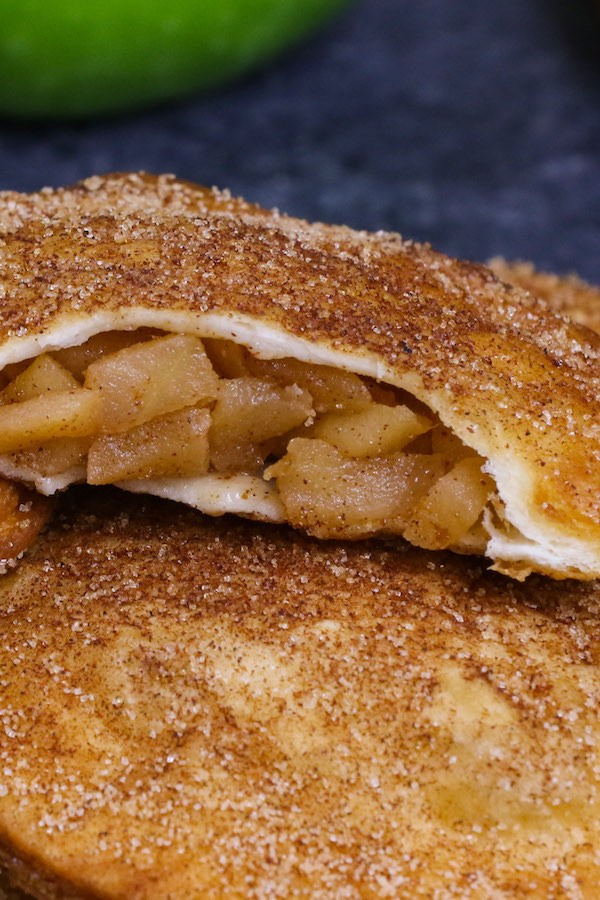 Cross-section of a fried apple pie showing the filling