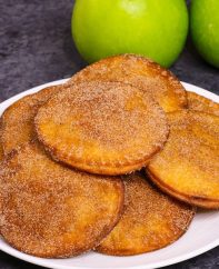 Fried Apple Pies - soft and sweet on the inside and crispy and flaky on the outside, the easiest dessert that takes less than 20 minutes! Totally irresistible! All you need is a few simple ingredients: apples, lemon, cinnamon sugar, butter, tortillas and egg. Plus Video recipe! Tipbuzz.com #friedApplePie