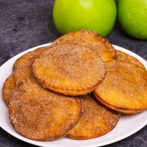 Fried Apple Pies - soft and sweet on the inside and crispy and flaky on the outside, the easiest dessert that takes less than 20 minutes! Totally irresistible! All you need is a few simple ingredients: apples, lemon, cinnamon sugar, butter, tortillas and egg. Plus Video recipe! Tipbuzz.com #friedApplePie