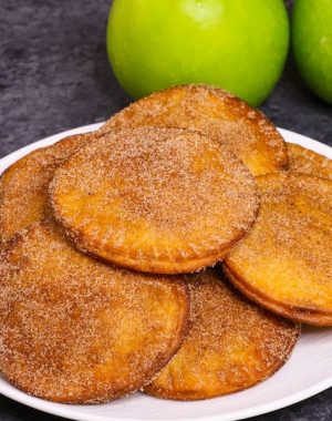 Fried Apple Pies - soft and sweet on the inside and crispy and flaky on the outside, the easiest dessert that takes less than 20 minutes! Totally irresistible! All you need is a few simple ingredients: apples, lemon, cinnamon sugar, butter, tortillas and egg. Plus Video recipe! Tipbuzz.com #friedApplePie