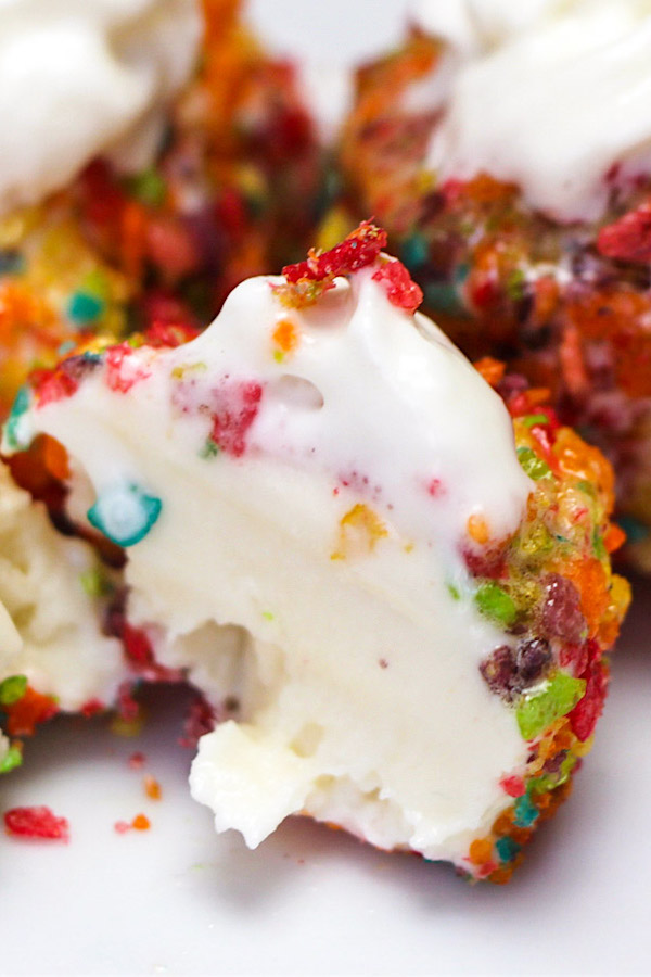 The creamy middle of ice cream coated with Fruity Pebbles cereal