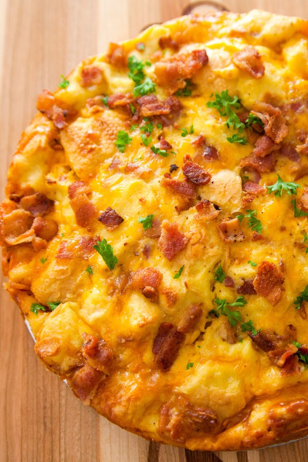 A fluffy and perfect Frittata – loaded with bacon, cheese, eggs and vegetables. Once you know the basics, the filling options are endless. It takes less than 20 minutes and is a great recipe to clean out the refrigerator!