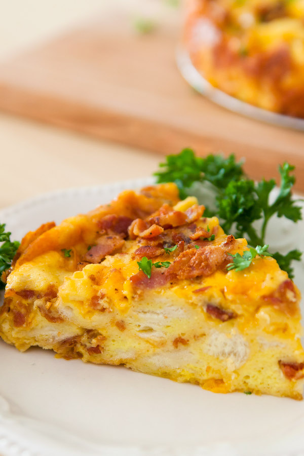 A fluffy and perfect Frittata – loaded with bacon, cheese, eggs and vegetables. Once you know the basics, the filling options are endless. It takes less than 20 minutes and is a great recipe to clean out the refrigerator!