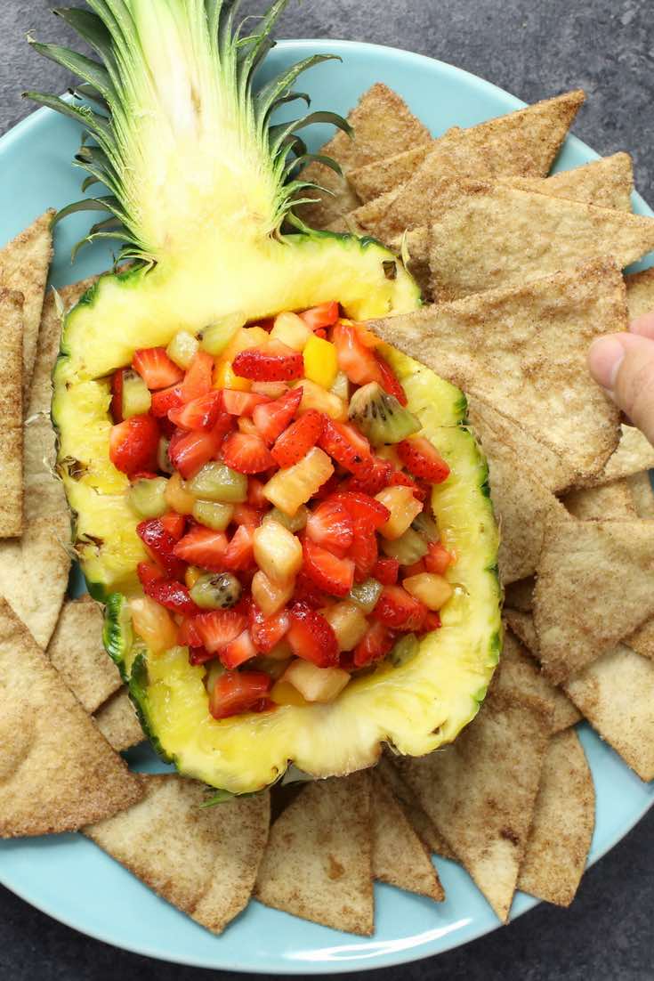 Pineapple boat serving presentation for salsa with chips on the side