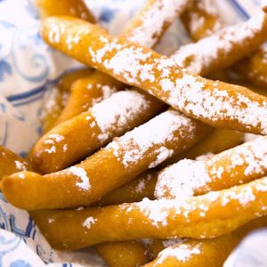 Funnel Cake Fries are delicious snacks that are crispy on the outside and fluffy on the inside. This state fair-inspired funnel cake recipe is easy to make in 20 minutes. Perfect for a party served with your favorite dipping sauces!