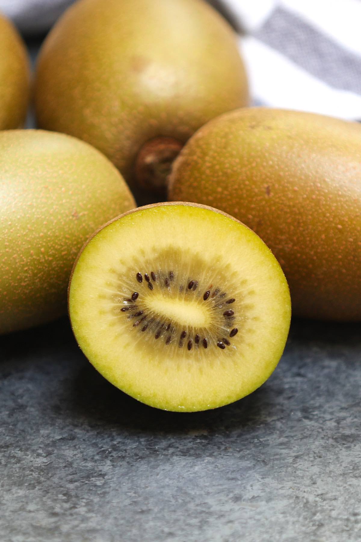 Closeup of a golden kiwi cut in half