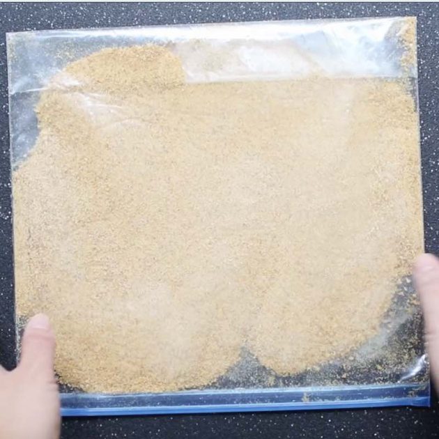 Pulverized graham cracker crumbs in a resealable plastic bag