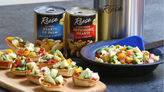 This is a closeup photo of vegan Heart of Palm Ceviche Cups on a party platter