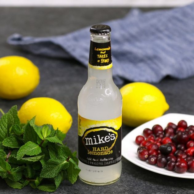 Holiday Lemonade Cocktails ingredients: cranberries, lemons, fresh mint and Mike's Hard Lemonade