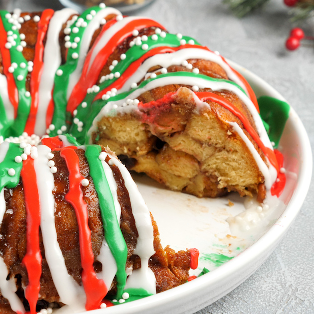 Moist and gooey Monkey bread warm out of oven drizzled with icing 