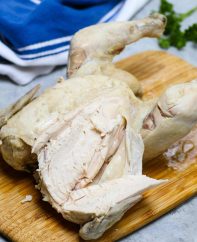 Carving up a whole boiled chicken
