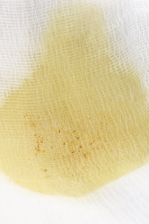 When you're considering how to make clarified butter, a cheesecloth is helping for removing any specks of browned milk solid that may have formed on the bottom of the pan during clarification