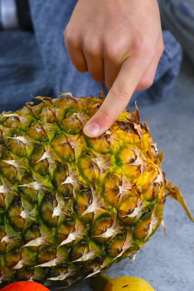 Pineapple skin giving slightly when pressed