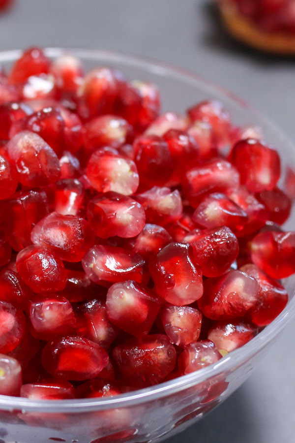 A bowl full of juicy arils after seeding the pomegranate