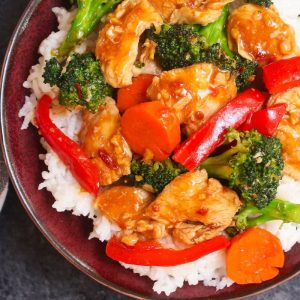 Hunan Chicken is a spicy stir-fry dish with sliced chicken breast and mixed vegetables in a hot and savory Hunan sauce that rivals authentic Chinese takeout.