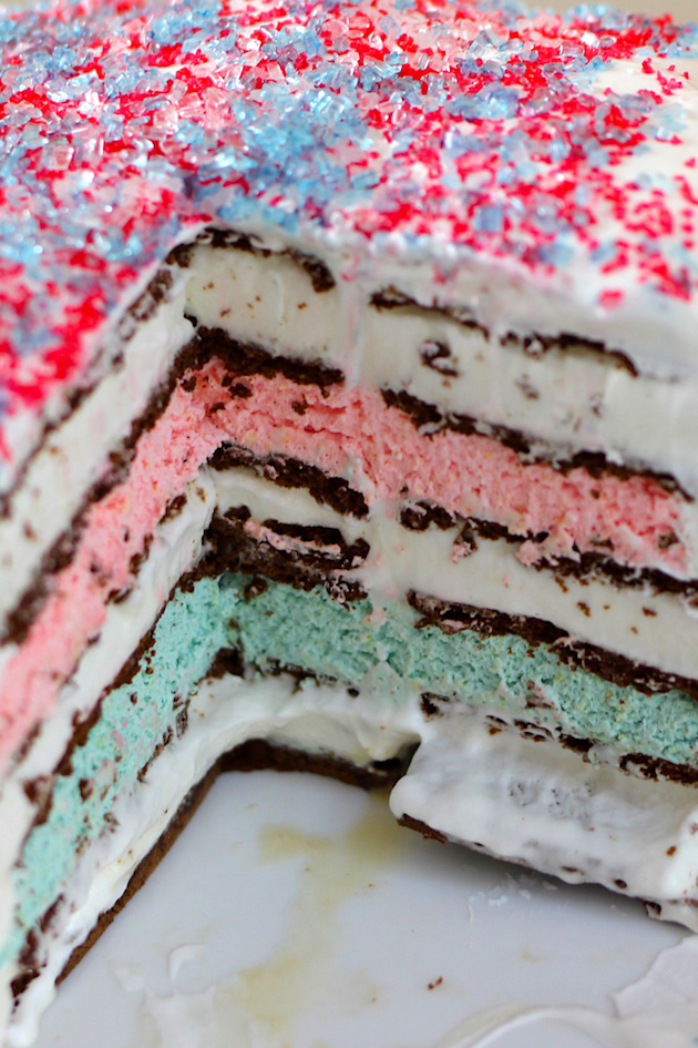 Closeup photo showing the layers of an ice cream sandwich cake with sprinkles on top