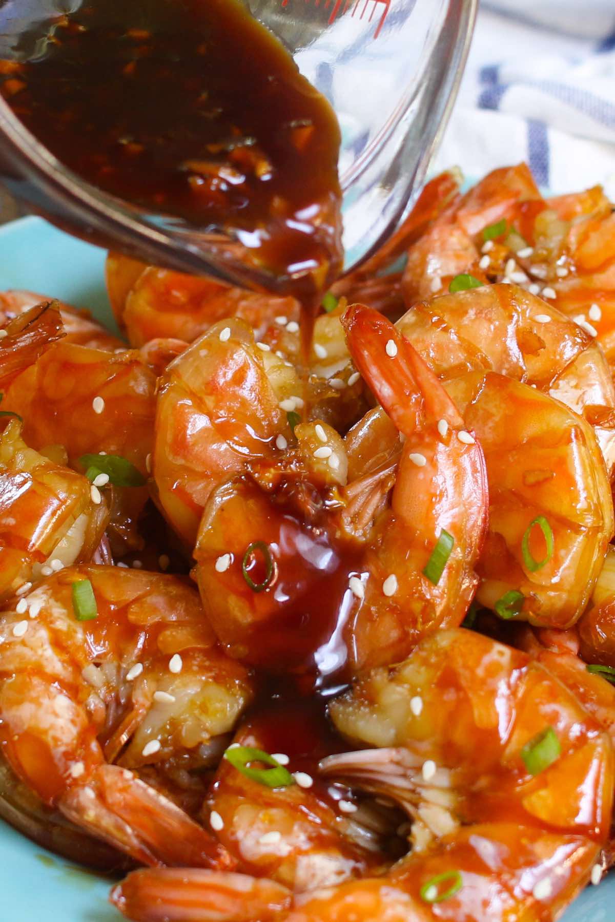 Drizzling honey garlic sauce onto this delicious Instant Pot shrimp recipe to create the signature sticky and sweet flavor that coats the shrimp