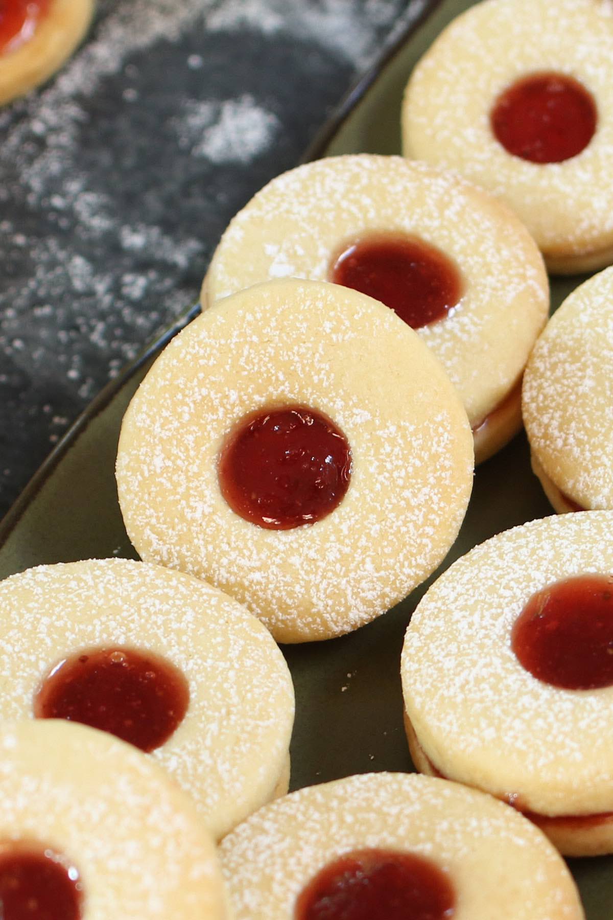 These soft and buttery homemade Jammie Dodgers are a UK staple! They are two shortbread biscuits sandwiched together with fruity jam such as strawberry or raspberry.