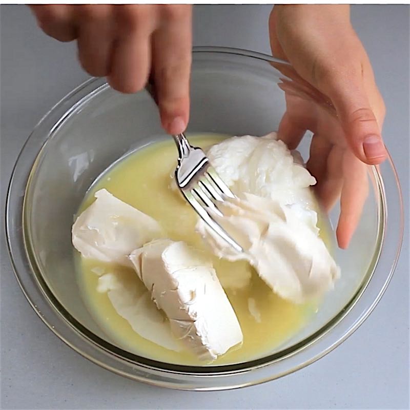 Making the filling for key lime pie in a mixing bowl