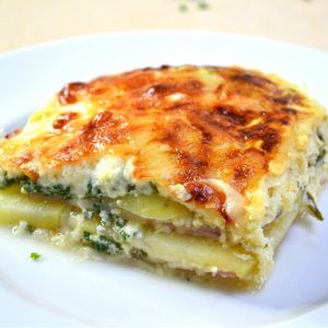 Cheesy Ham and Potato Casserole – you can’t resist this simple, classic layered ham and cheese bake that’s easy to make for brunch, lunch or dinner! All you need is a few ingredients: potatoes, ham, swiss cheese, parsley, eggs and half and half milk. Quick and easy dinner idea. Video recipe. | tipbuzz.com
