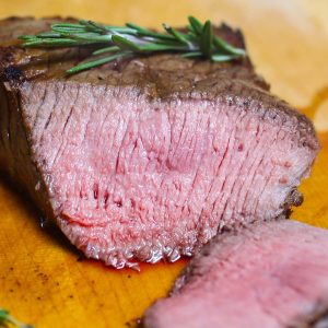 Cross-sectional view of London Broil cooked medium showing the pale pink color and juicy meat