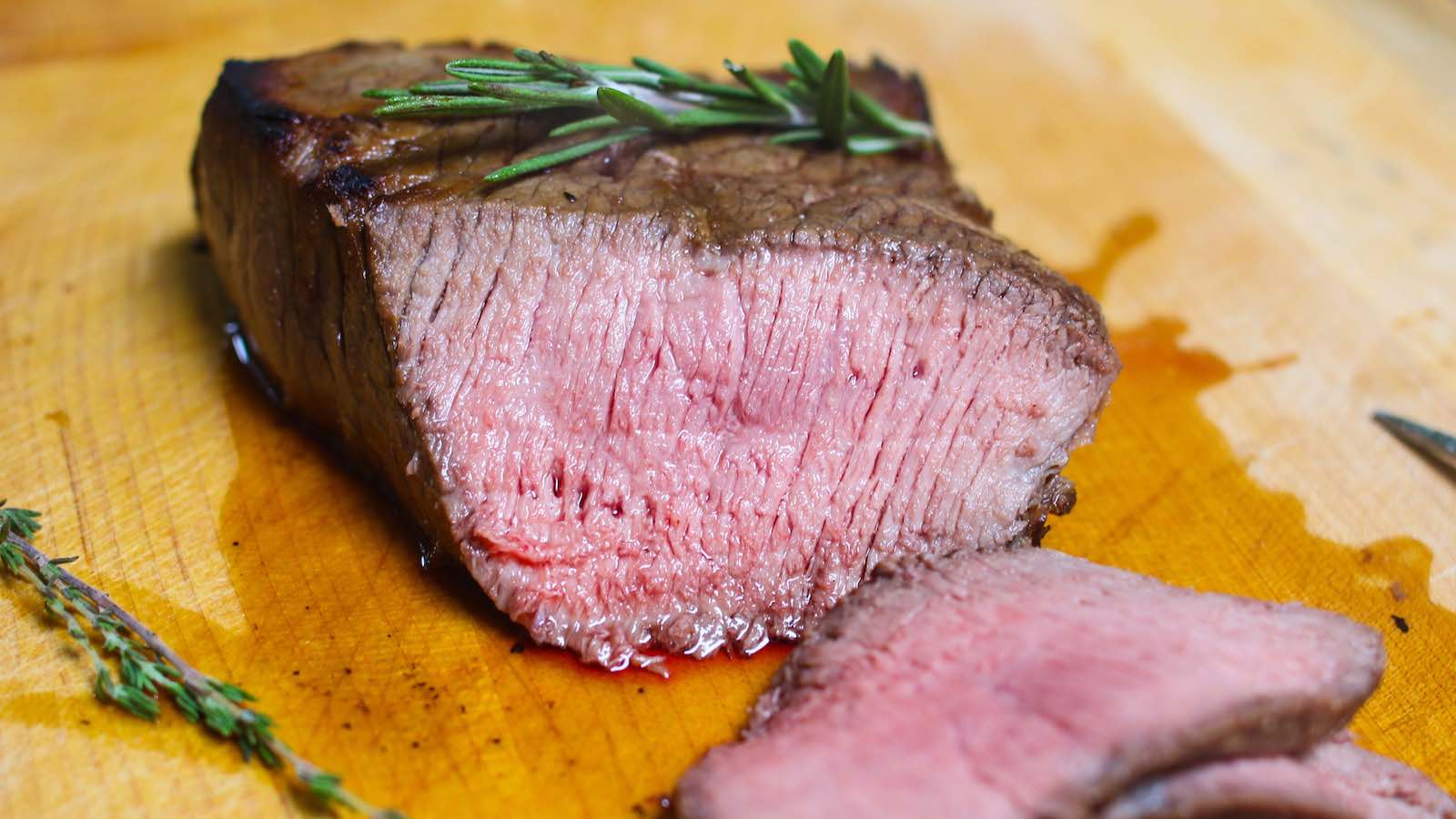 Cross-sectional view of London Broil cooked medium showing the pale pink color and juicy meat