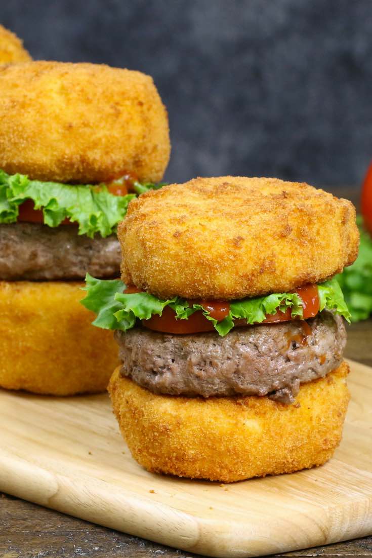 Mac and cheese burgers garnished with lettuce and tomato