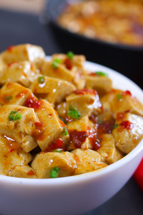 Mapo Tofu closeup showing minced pork, fresh red chilis and green onion