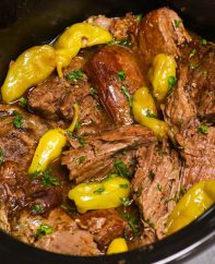 Mississippi Pot Roast is a fork-tender chuck roast that’s full of flavor! This no-fuss “dump and go” pot roast recipe is made with 5 ingredients in a crockpot with only 10 minutes of prep!