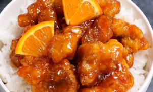 This Orange Chicken has crispy chunks of tender chicken covered in a tangy orange sauce. It makes a delicious weeknight dinner that’s budget friendly and kid approved.