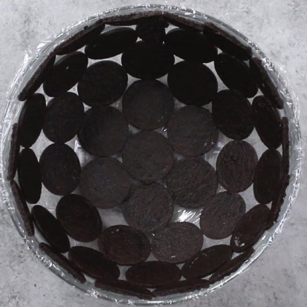 Oreo Cake - this photo shows oreo cookies molded to a glass bowl as the first step in making no bake oreo cake