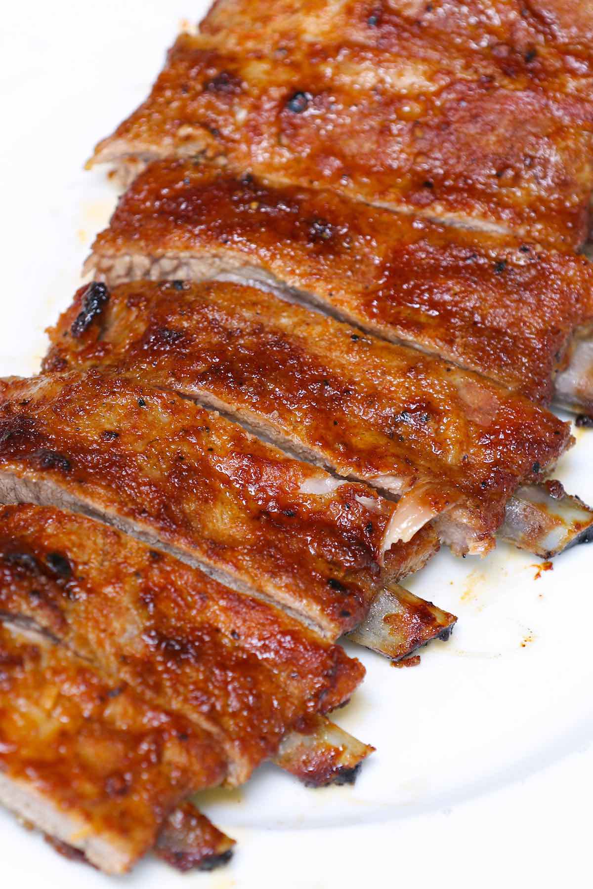 Closeup of oven baked St Louis style ribs on a serving platter