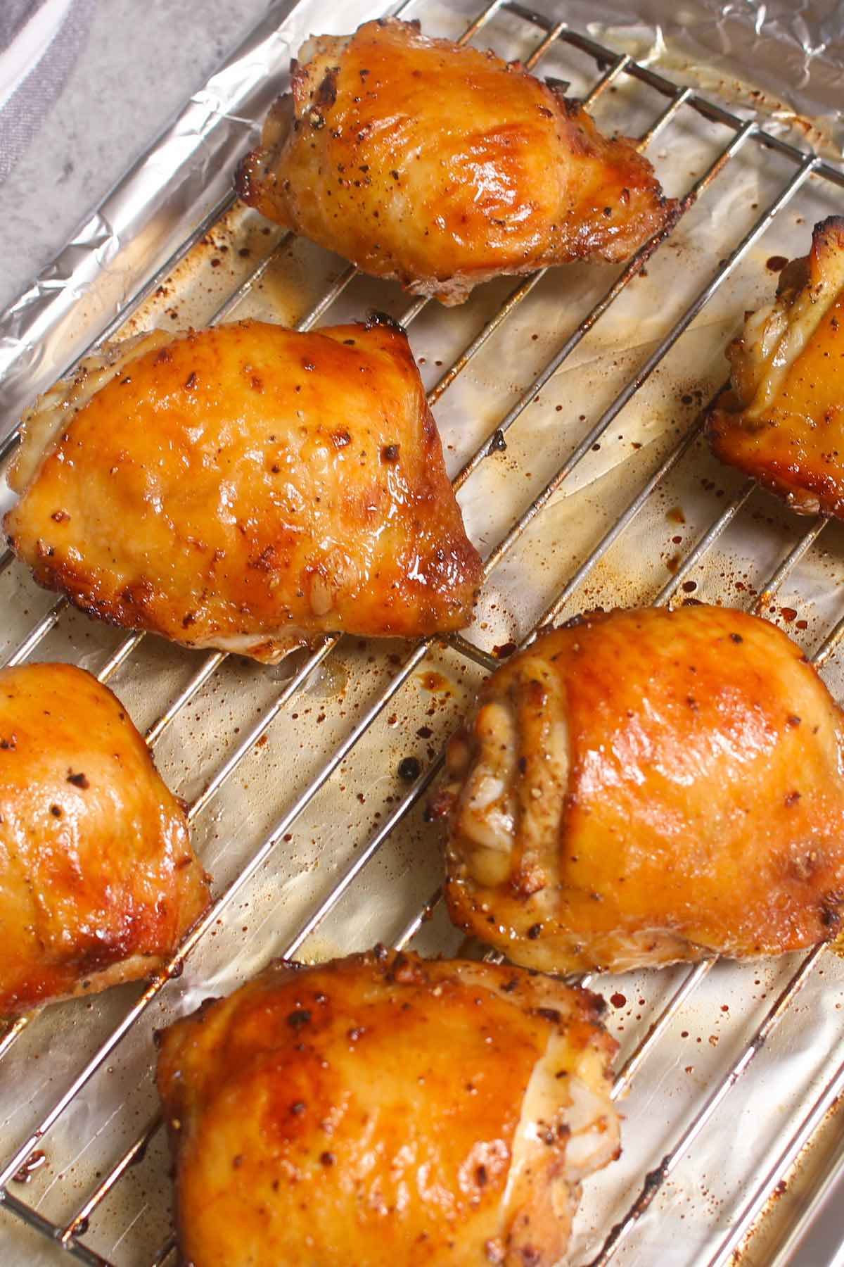 Oven Baked Chicken Thighs are crispy on the outside with tender dark meat on the inside. With a few tips and some simple ingredients, these never-dry chicken thighs can be easily made at home with restaurant-quality!