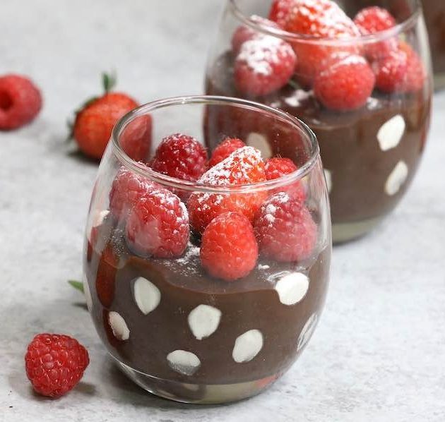 Polka Dot Chocolate Pudding servings in stemless wine glasses showing the dramatic color contrast of dark chocolate pudding interspersed with white marshmallow polka dots