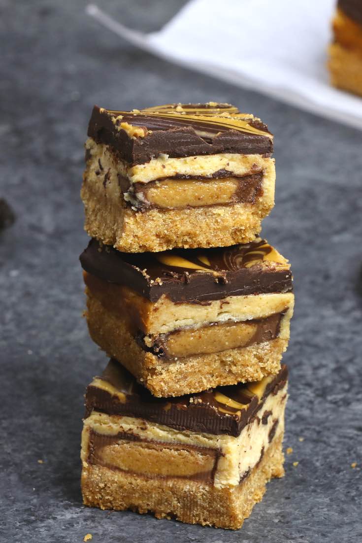 A stack of chocolate peanut butter cheesecake bars