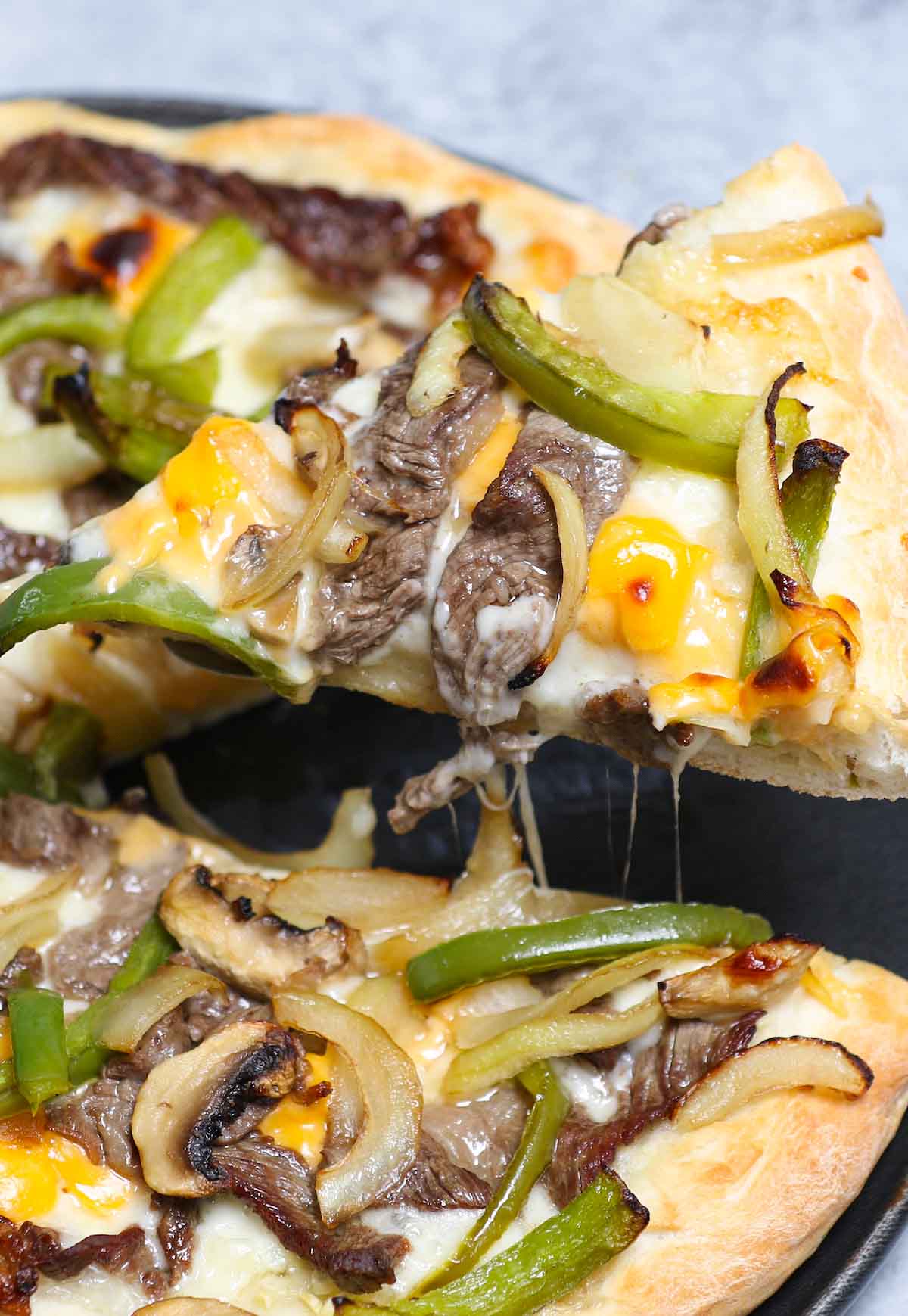 A slice of homemade Domino's Philly Cheese Steak Pizza