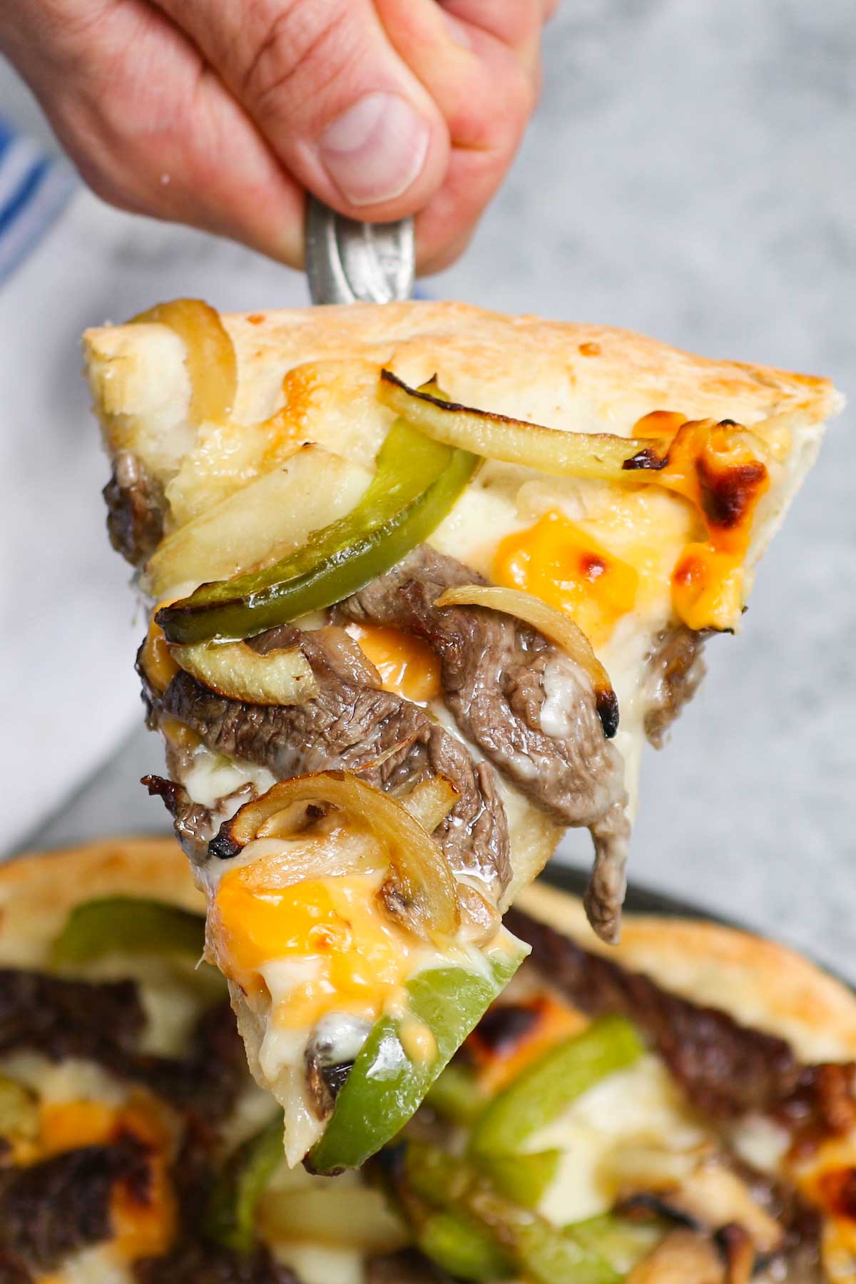 Closeup of a slice of homemade Domino's Philly Cheese Steak Pizza