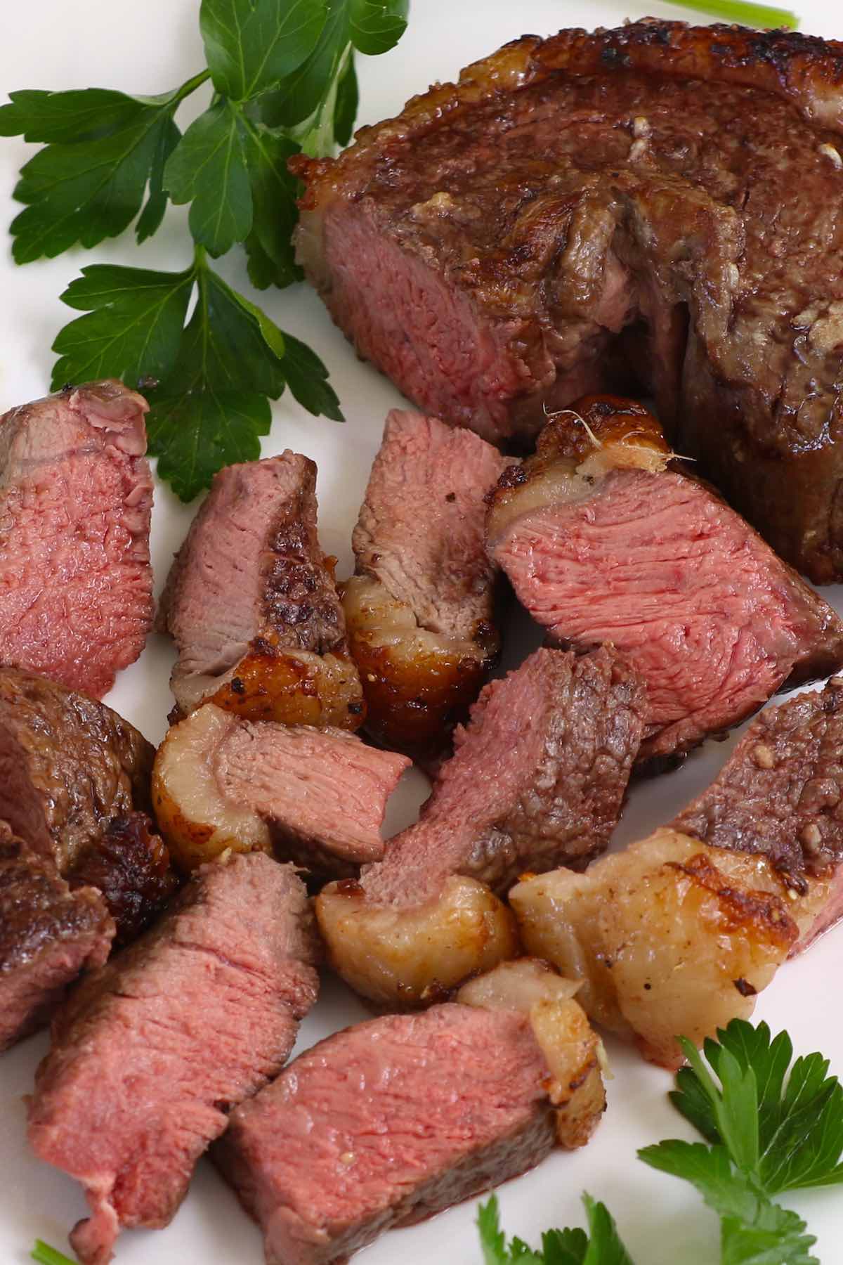 Picanha cooked medium and cut into pieces for serving