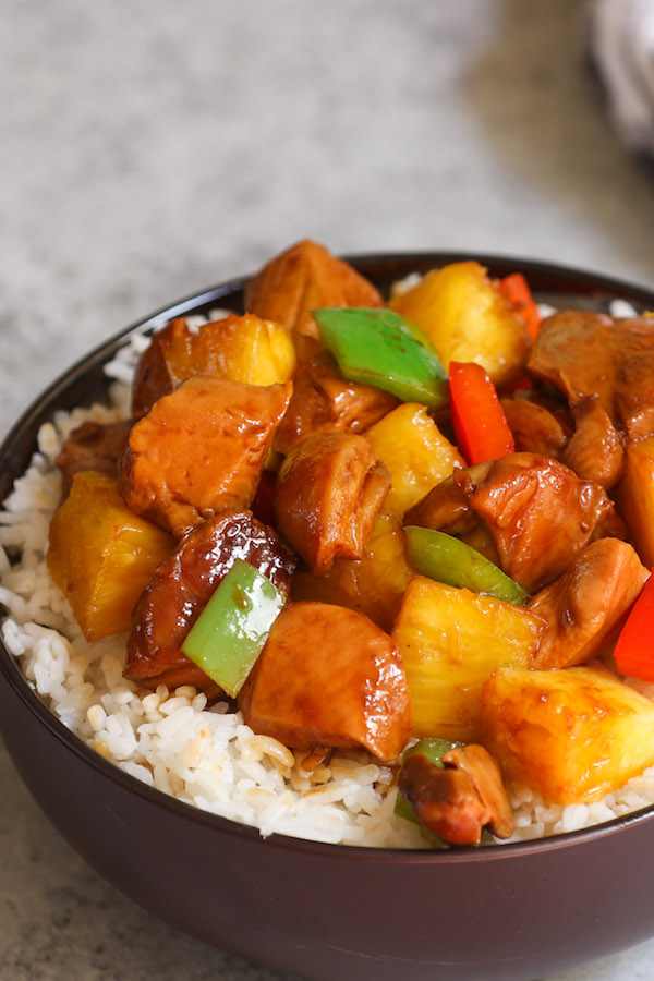 This Pineapple Chicken Recipe features chicken thighs, red and green bell peppers, pineapple chunks in a tangy sauce