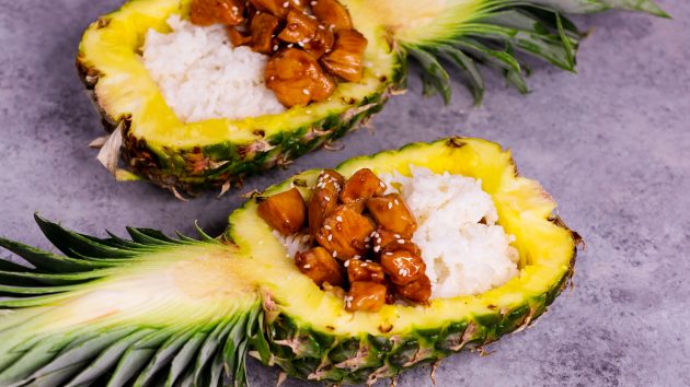 Pineapple Teriyaki Chicken served with rice in a fresh pineapple