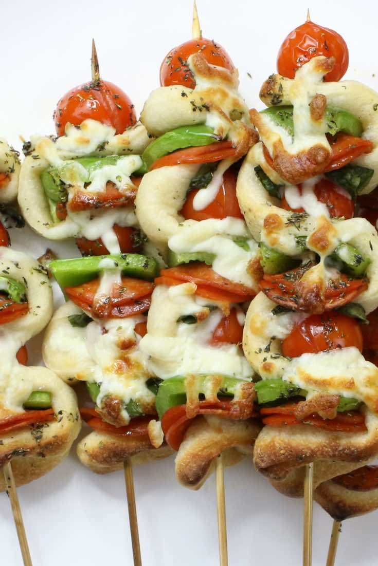 Pizza kabobs made with bell peppers, cherry tomatoes and mozzarella cheese