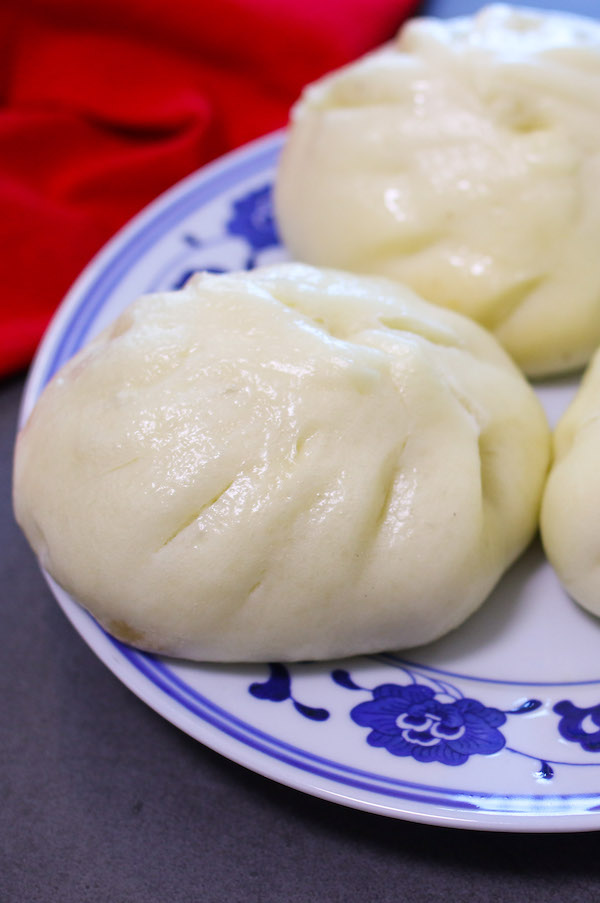 Chinese pork buns on a serving plate ready to be eaten