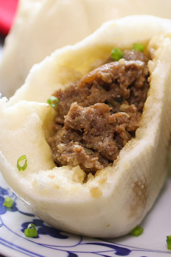 Closeup of the meat filling inside a Chinese pork bun