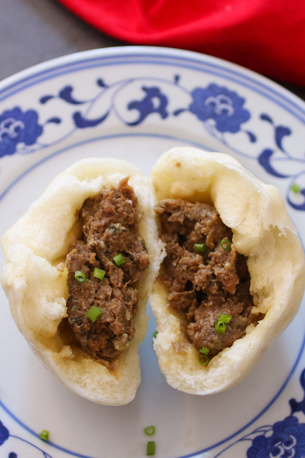 Freshly steamed pork buns with a soft texture and juicy filling inside