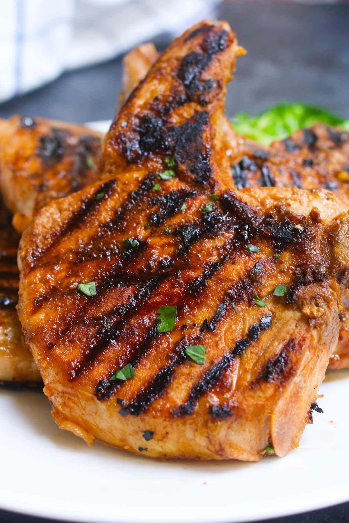 The Best Ever Pork Chop Marinade produces tender and flavorful pork chops every time! It’s an easy pork marinade recipe made with soy sauce, brown sugar, vinegar, garlic, olive oil, and ketchup. You can use the marinated pork chops for grilling, pan frying, or baking. 