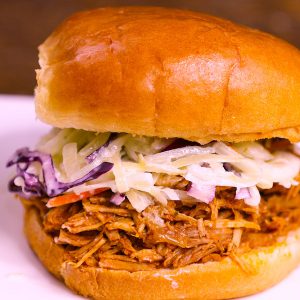 Pulled Pork Sandwich made with juicy and flavorful pork shoulder roast, smothered in a smoky and sweet barbecue sauce. Serve it on your favorite buns with coleslaw for an unforgettable meal!